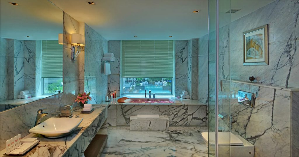 Taj Hotel & Convention Centre Washroom with jacuzzi