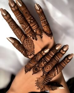 Back hand mehndi design with detailed finger patterns