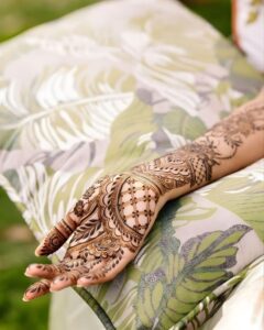 Mehndi paste drying on hands during the waiting stage